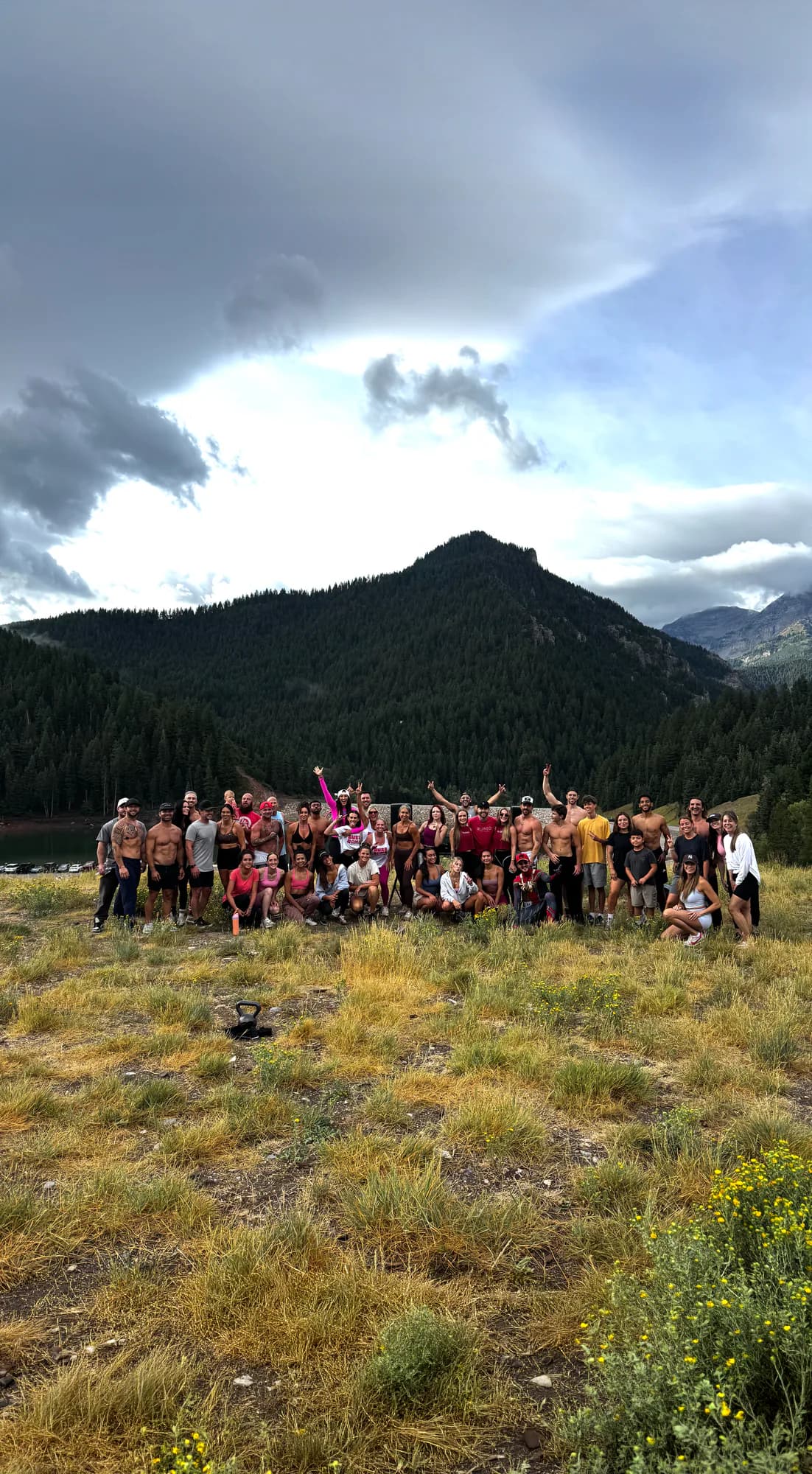 People gathered on the shore of Tibble Fork Reservoir at a past Ruined event.